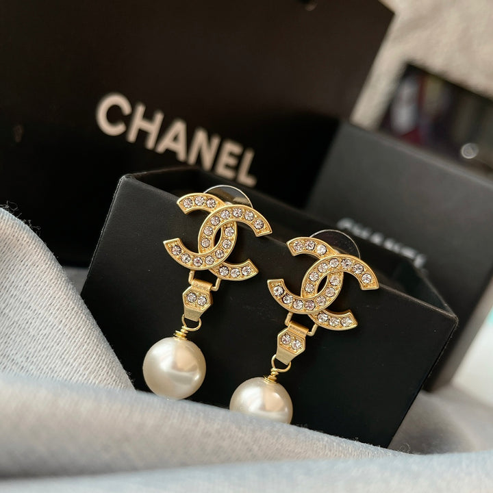 New double C gold coloured dangling pearl earrings