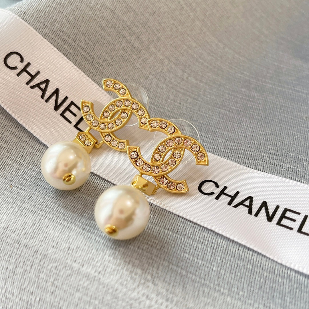 New double C gold coloured dangling pearl earrings