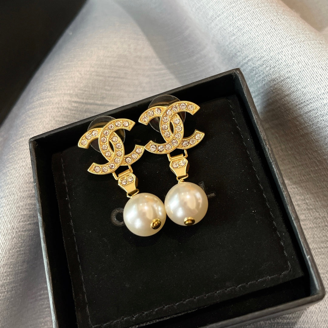 New double C gold coloured dangling pearl earrings