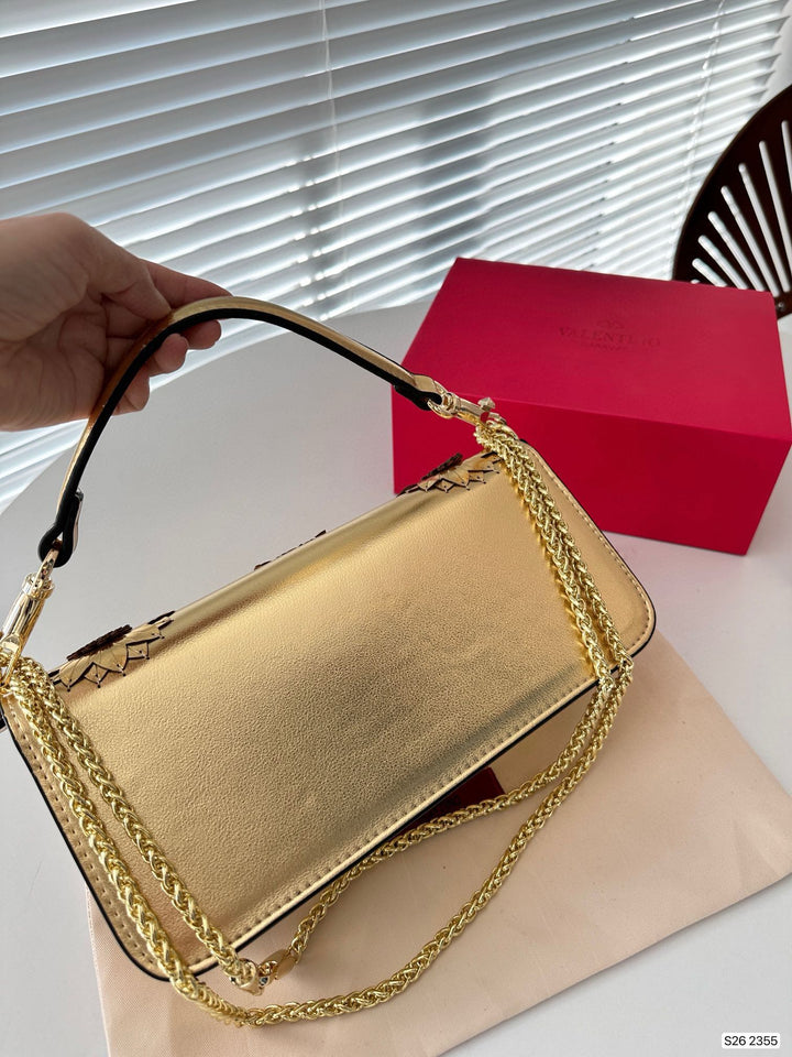 Gold appliquéd sheepskin shoulder bag