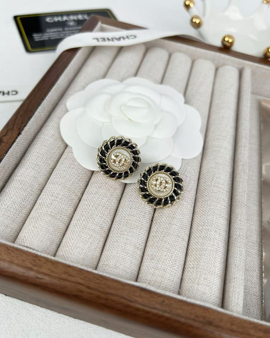 Black pierced leather rhinestone round earrings