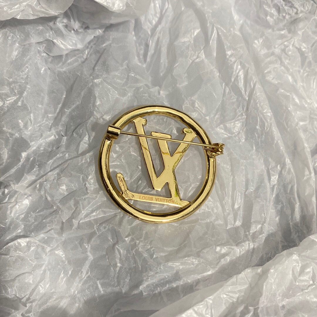 Gold letter brooch