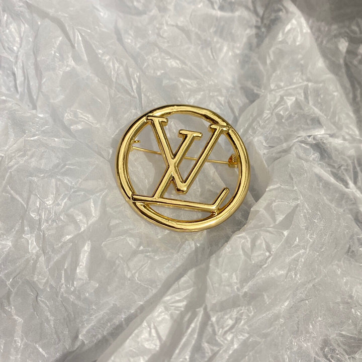 Gold letter brooch