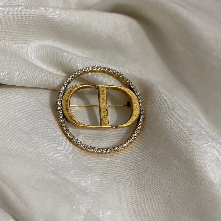 Gold CD letter brooch