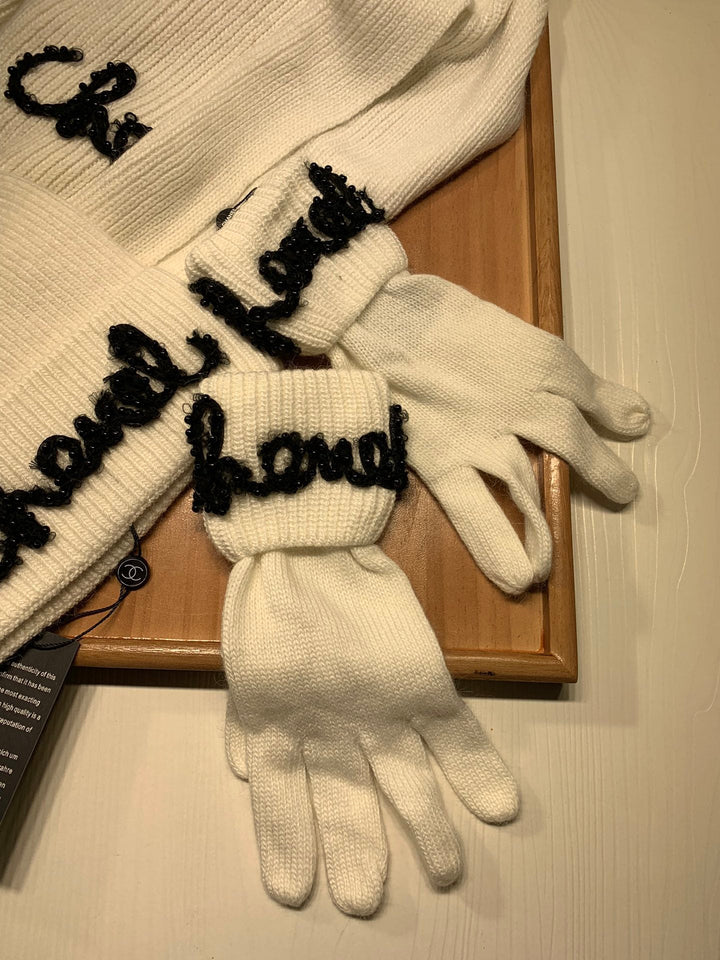 White winter wool hat and scarf and gloves