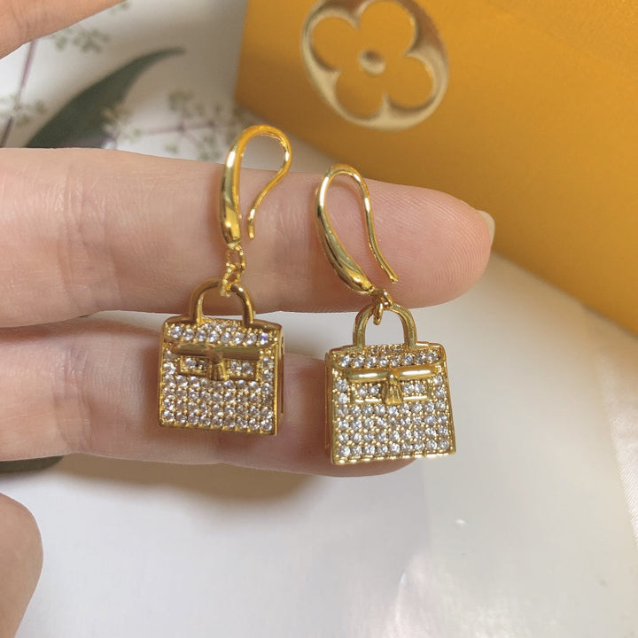 Gold bag-shaped earrings