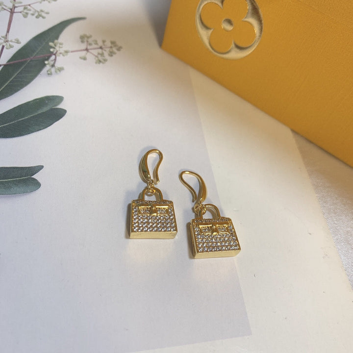 Gold bag-shaped earrings