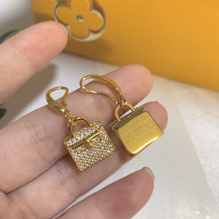 Gold bag-shaped earrings