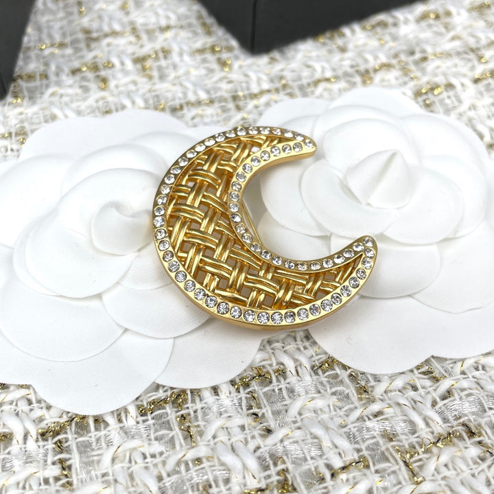 Gold crescent moon brooch