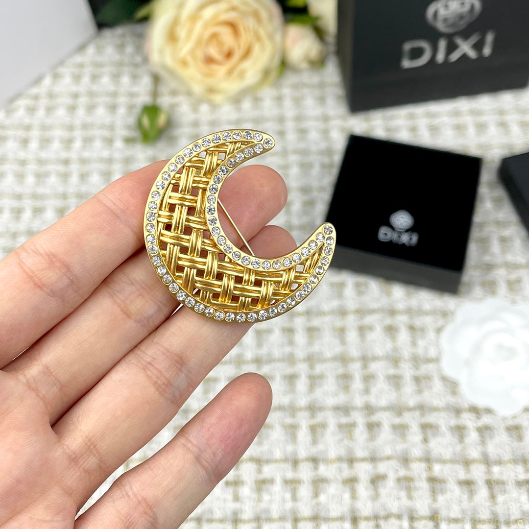 Gold crescent moon brooch